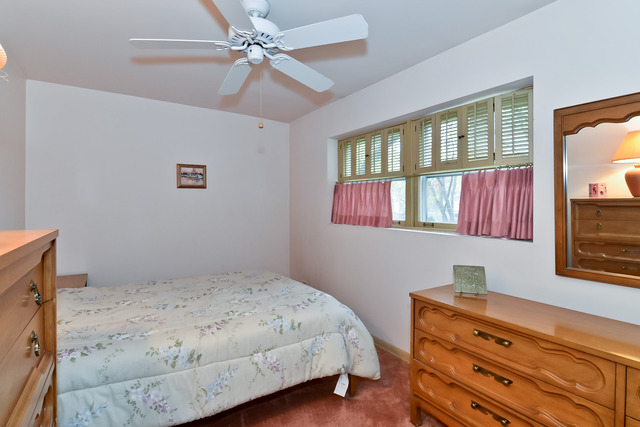 1326 Linden Road Homewood, IL 60430 - Photo 9 of 10 a bedroom with a bed dresser and a window