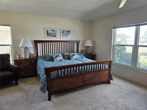 a bedroom with furniture and a window