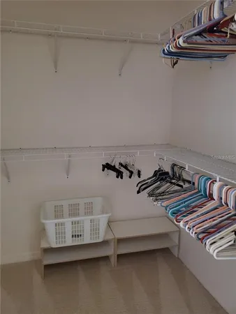 a bedroom with a bed and cabinets