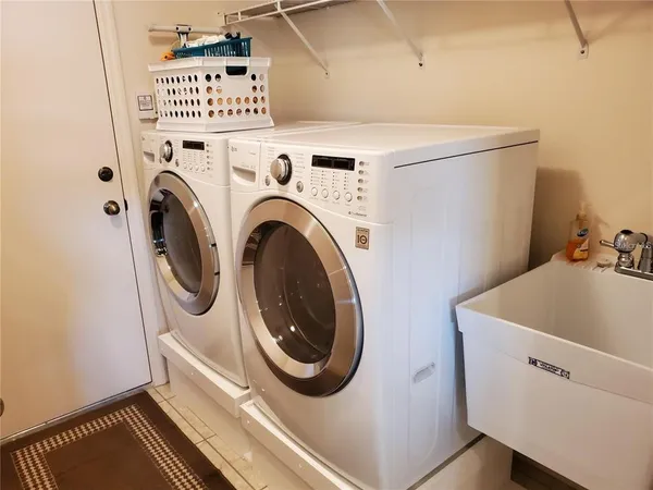 a utility room with dryer and washer
