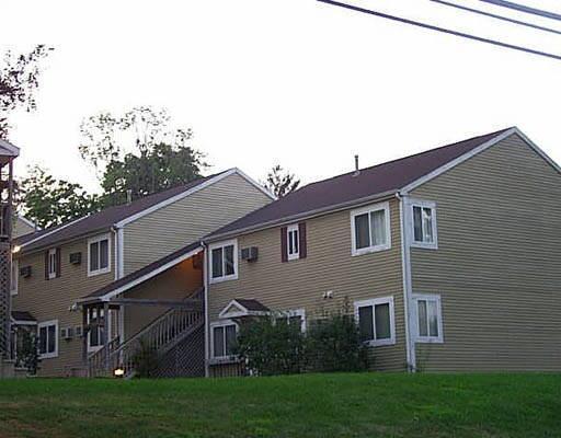 135 Flax Hill Road, Unit 10A Norwalk, CT 06854 - Photo 1 of 1 a view of a house with a yard