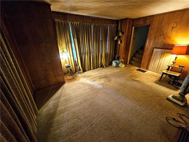 a bedroom with a bed and a mirror