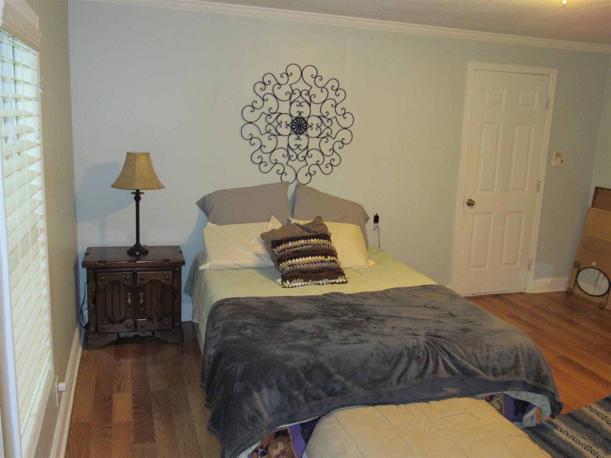 5354 Cathey Ridge Road Manchester, TN 37355 - Photo 11 of 22 a bedroom with a bed and a chandelier