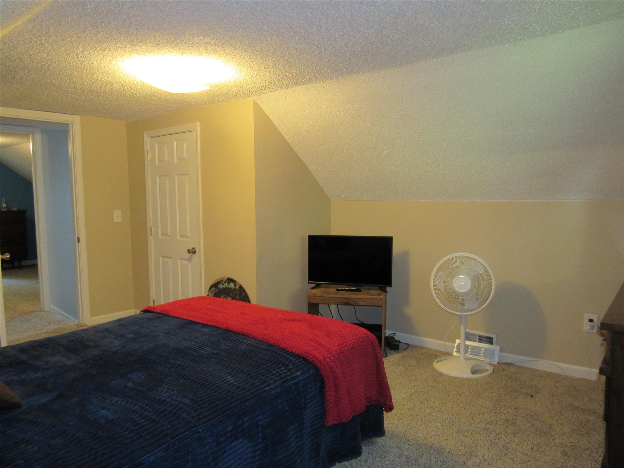 5354 Cathey Ridge Road Manchester, TN 37355 - Photo 14 of 22 a bedroom with a bed and a flat screen tv