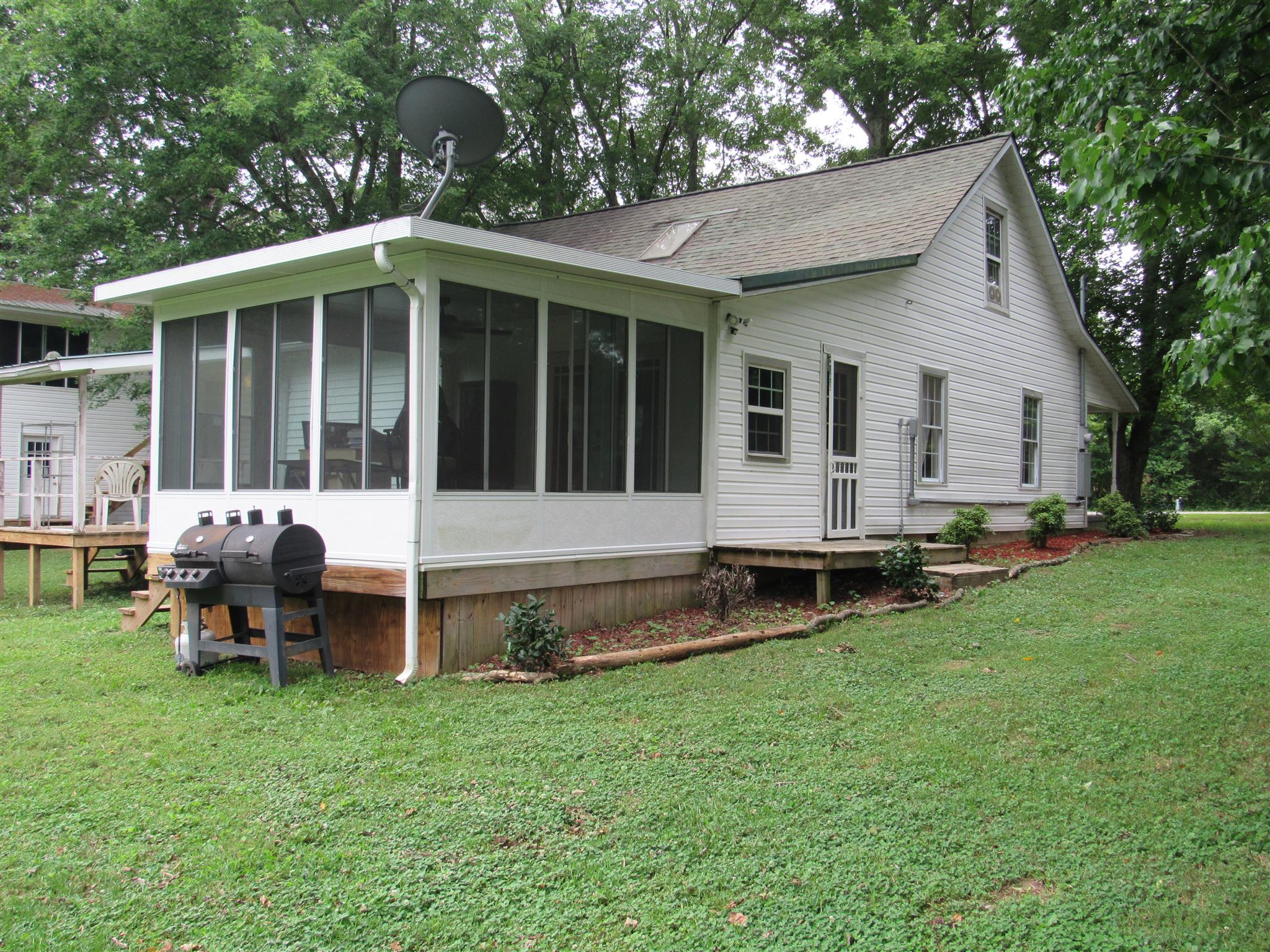 5354 Cathey Ridge Road Manchester, TN 37355 - Photo 19 of 22 a view of a house with backyard and sitting area