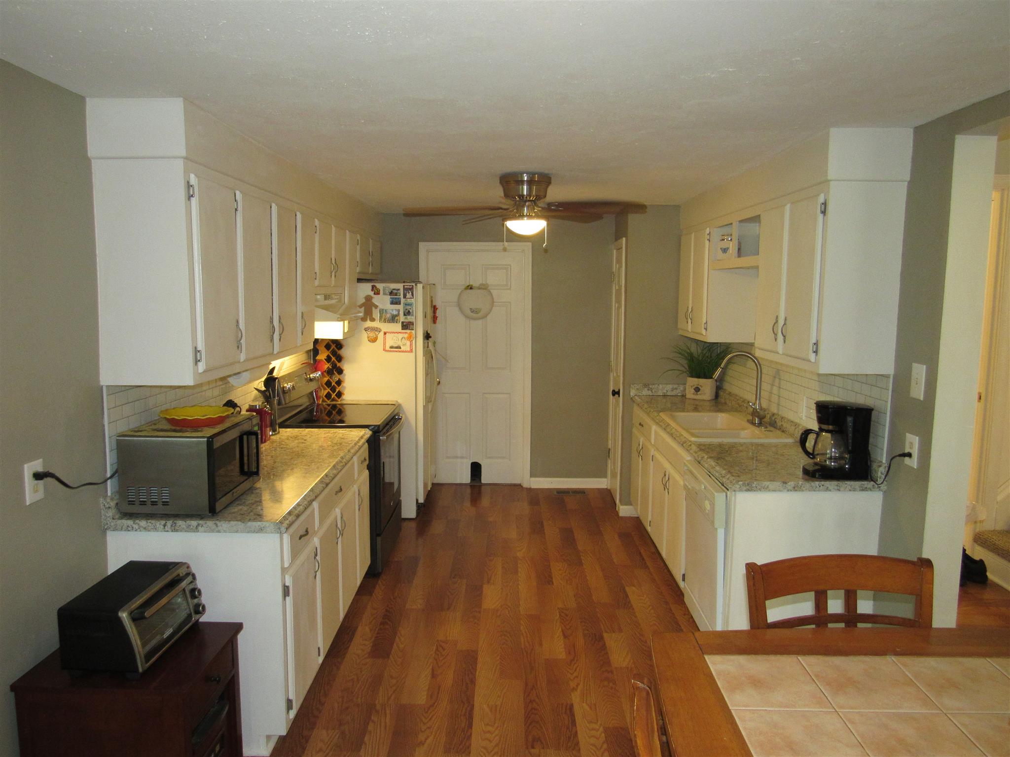 5354 Cathey Ridge Road Manchester, TN 37355 - Photo 5 of 22 a kitchen with sink a refrigerator and wooden floor
