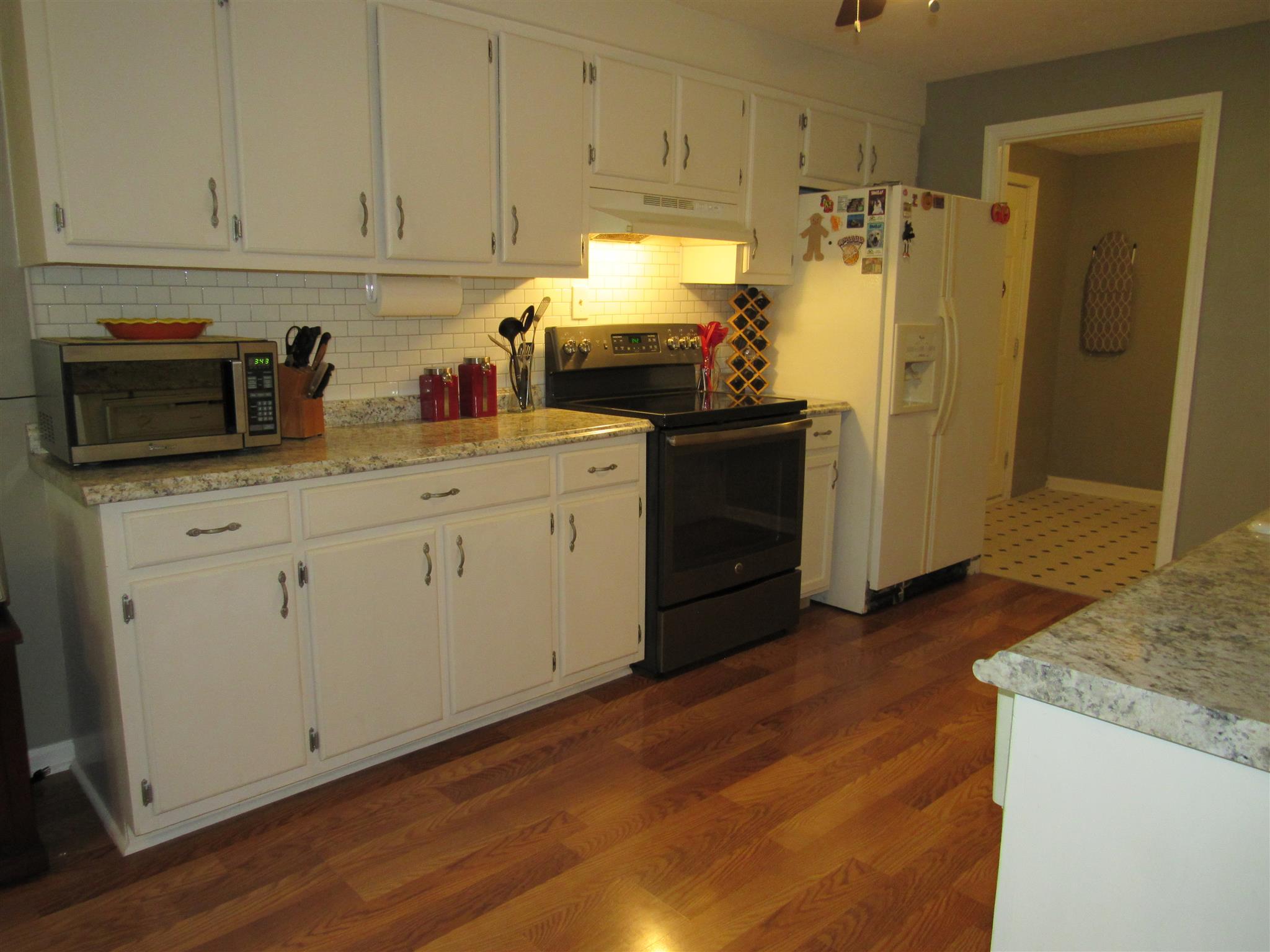5354 Cathey Ridge Road Manchester, TN 37355 - Photo 6 of 22 a kitchen with stainless steel appliances granite countertop a refrigerator sink and cabinets