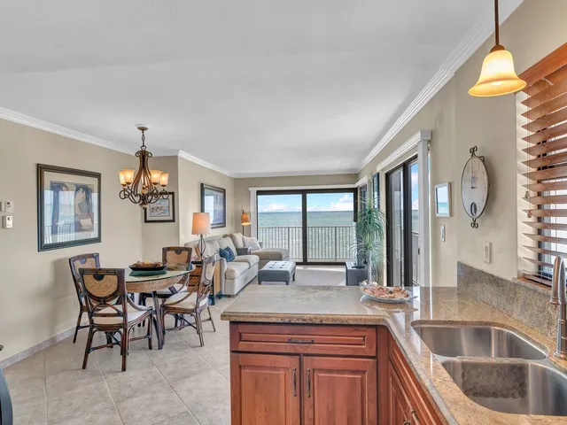 a bedroom with a large bed and a large window