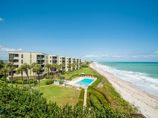 a view of a swimming pool with a lounge chairs