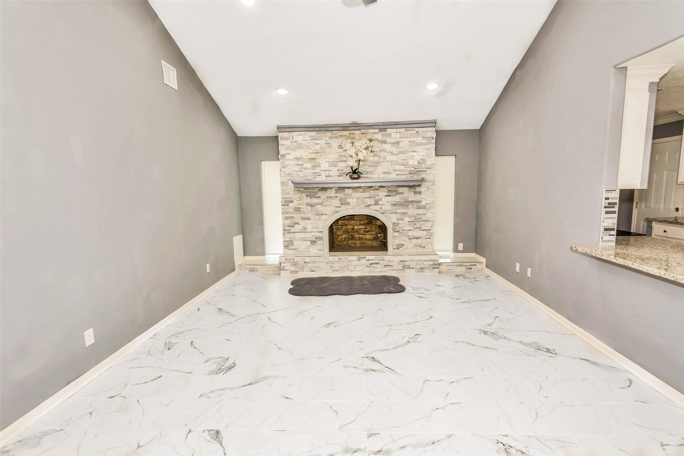 481 County Road 2084 Liberty, TX 77575 - Photo 5 of 21 Large living room with decorative brick fireplace, open to entry way and Kithchen