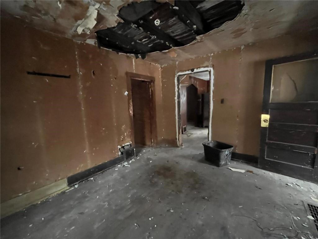 832 Oak Avenue Rochester, PA 15074 - Photo 13 of 50 a view of a hallway with a table and chandelier