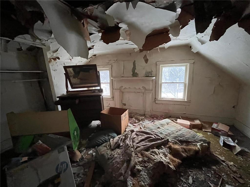 832 Oak Avenue Rochester, PA 15074 - Photo 18 of 50 a bed sitting in a bedroom next to a window with a tv