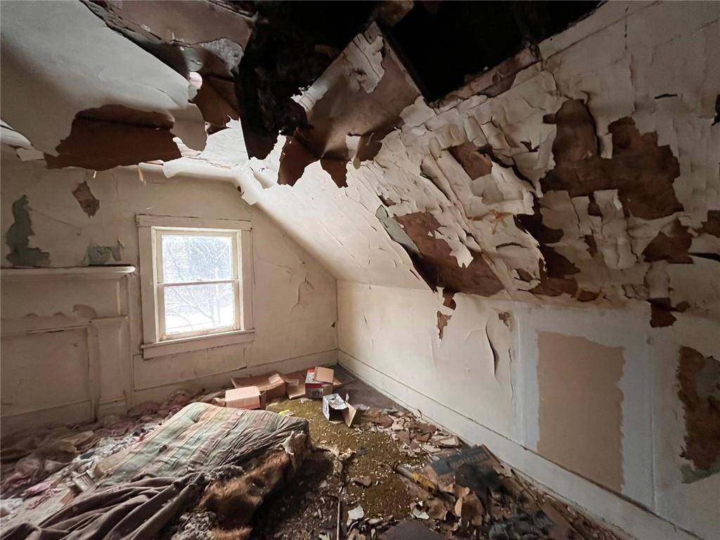 832 Oak Avenue Rochester, PA 15074 - Photo 20 of 50 a bed sitting in a bedroom next to a window