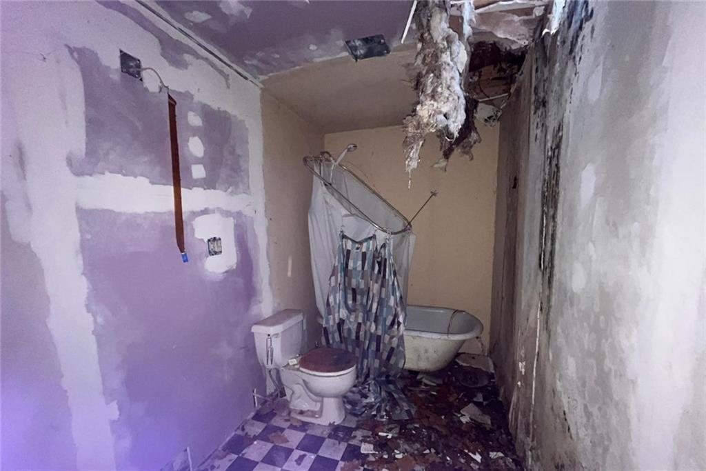 832 Oak Avenue Rochester, PA 15074 - Photo 27 of 50 a bathroom with a toilet sink and shower curtain