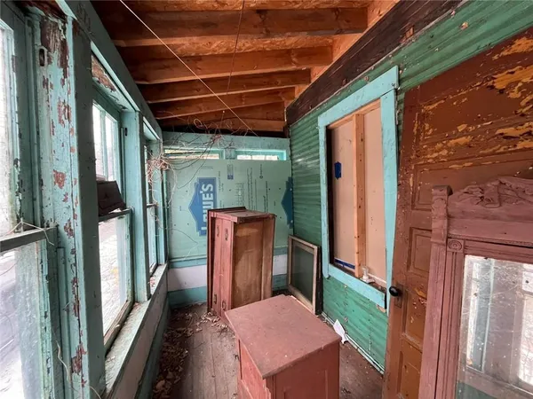 a view of a balcony with furniture
