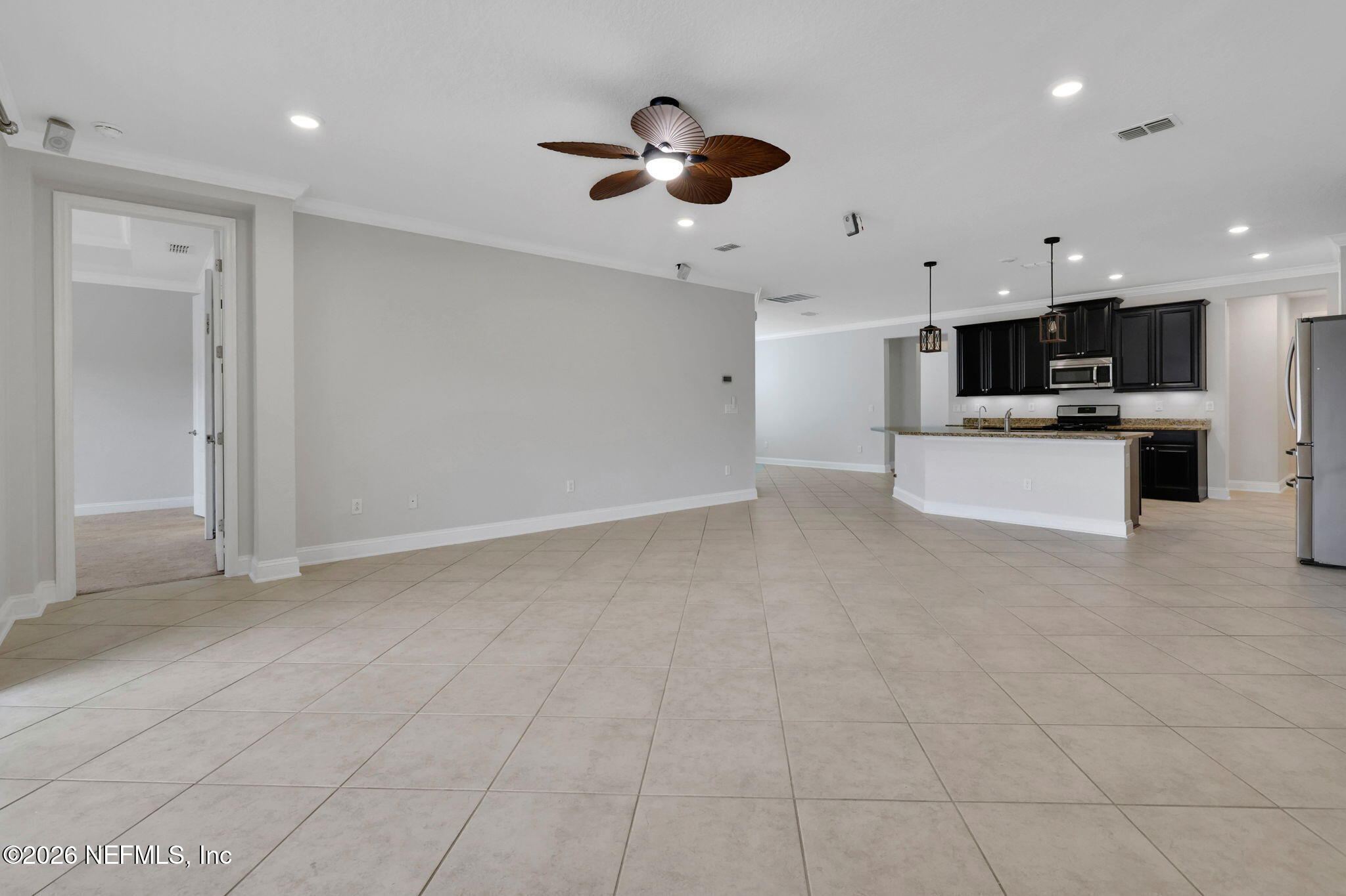 182 St Kitts Loop St. Augustine, FL 32092 - Photo 19 of 71 a view of kitchen with microwave and stove