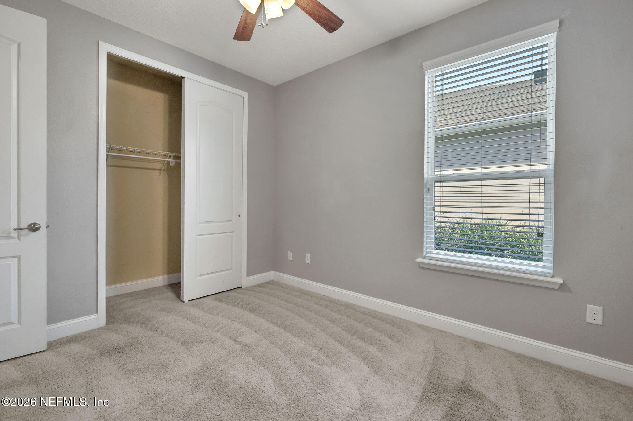 182 St Kitts Loop St. Augustine, FL 32092 - Photo 25 of 71 an empty room with windows and closet