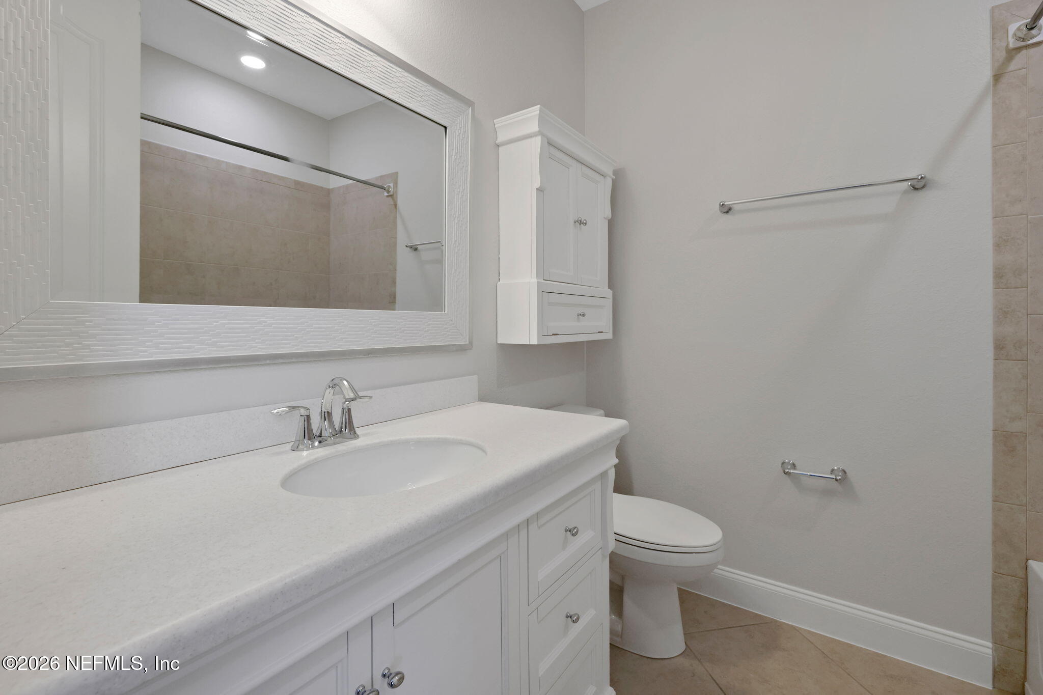 182 St Kitts Loop St. Augustine, FL 32092 - Photo 34 of 71 a bathroom with a sink toilet and mirror