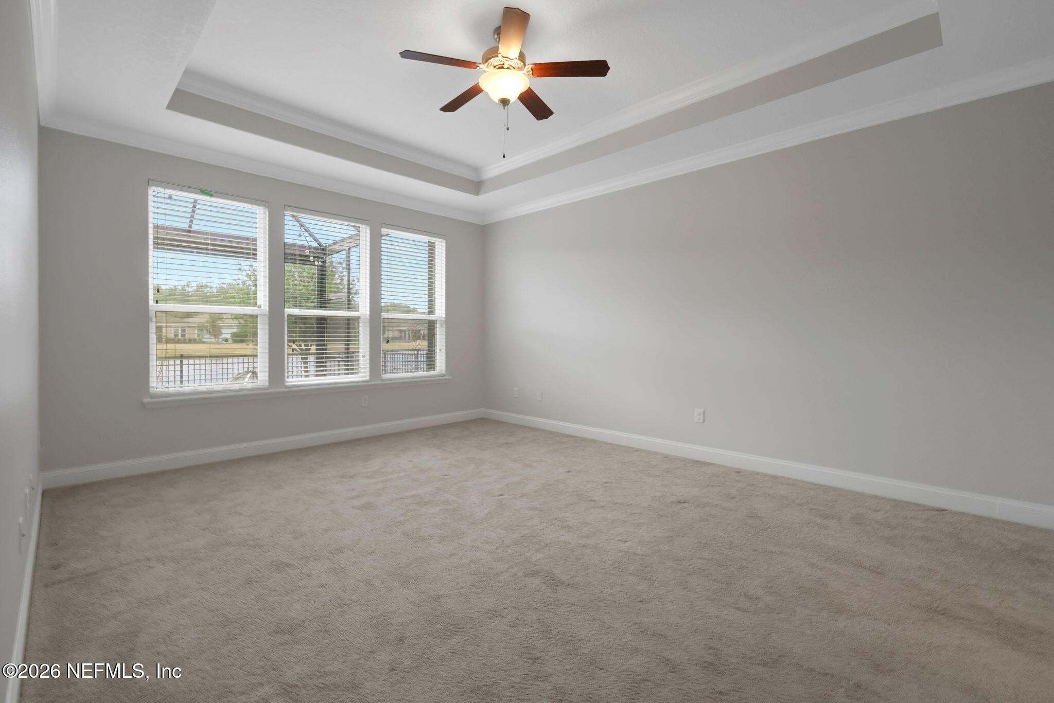 182 St Kitts Loop St. Augustine, FL 32092 - Photo 37 of 71 an empty room with windows and ceiling fan