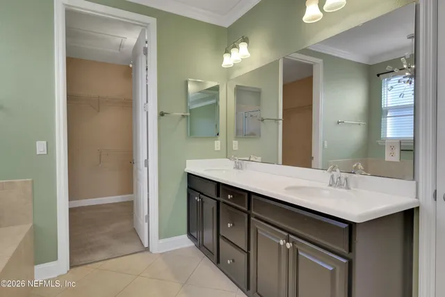 a view of cabinets with washer and dryer