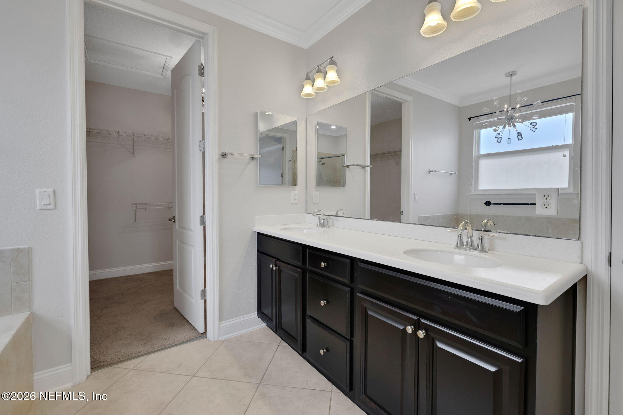 182 St Kitts Loop St. Augustine, FL 32092 - Photo 39 of 71 a bathroom with a sink double vanity and a mirror