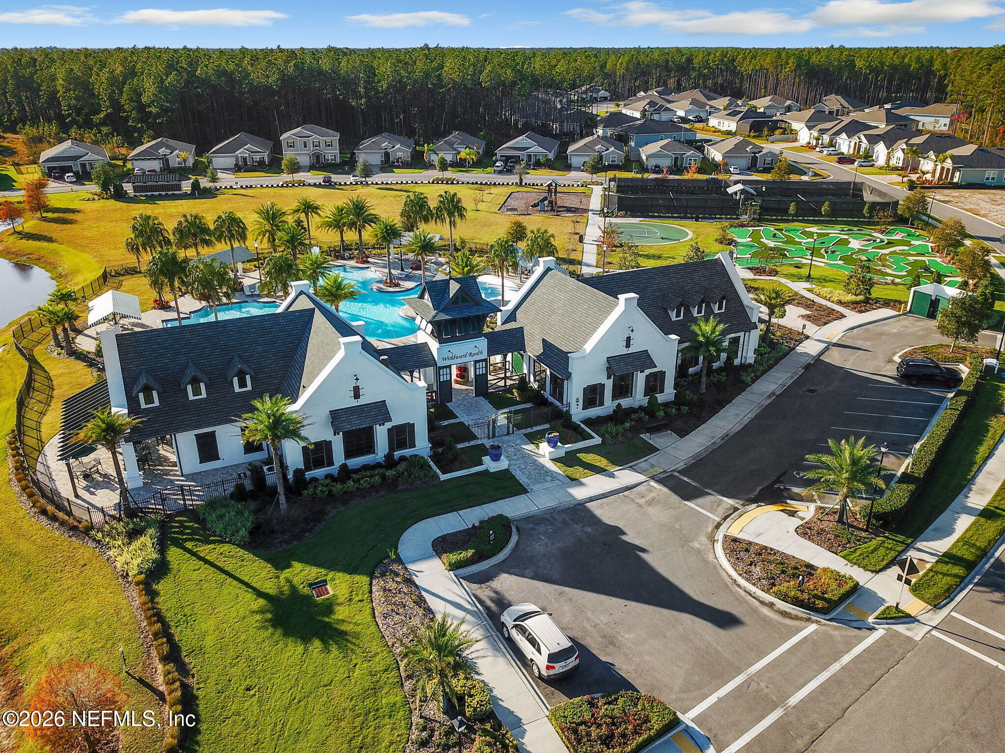 182 St Kitts Loop St. Augustine, FL 32092 - Photo 57 of 71 a view of a lake with a table and chairs