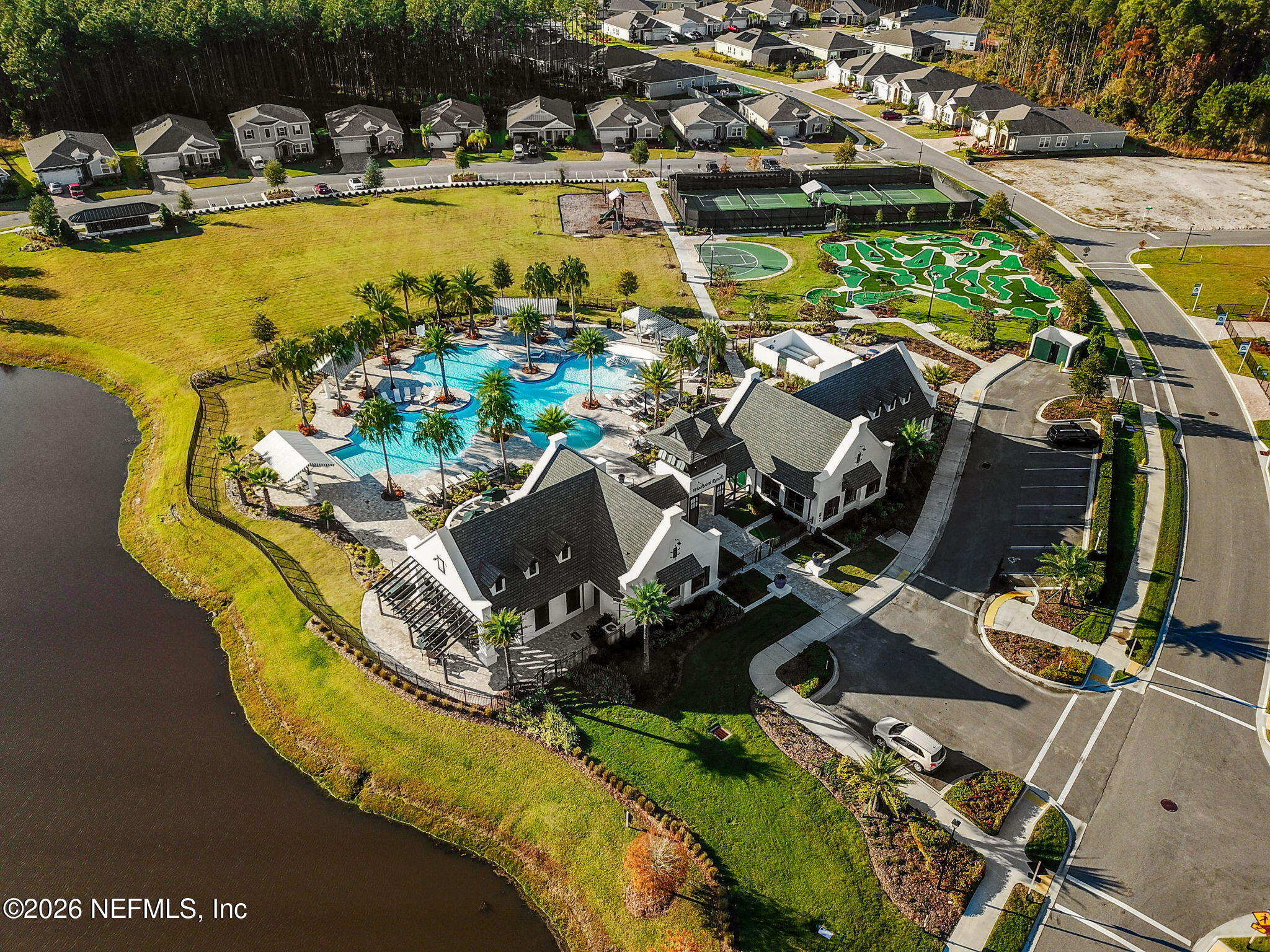 182 St Kitts Loop St. Augustine, FL 32092 - Photo 58 of 71 a view of a swimming pool with outdoor seating