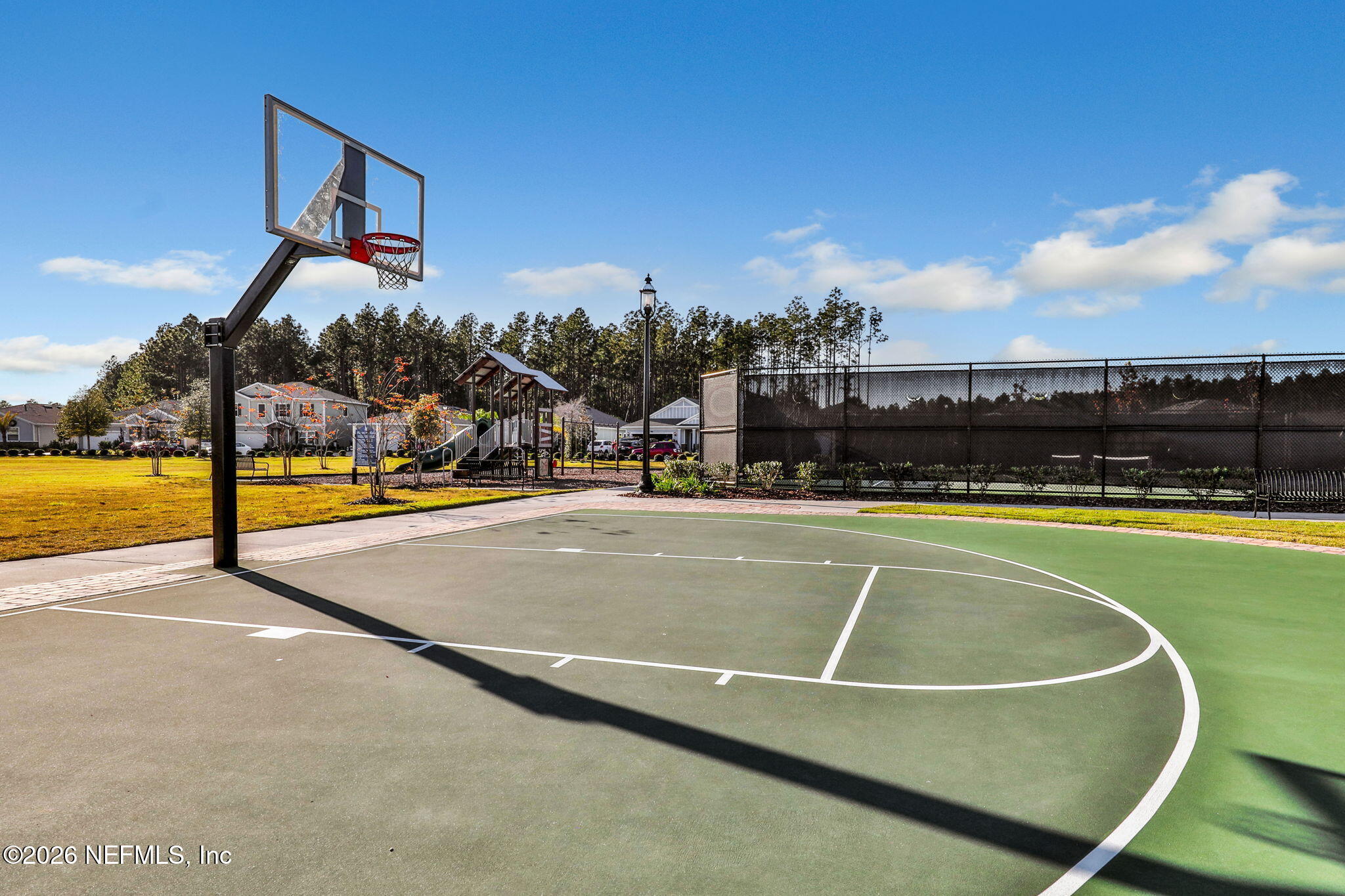 182 St Kitts Loop St. Augustine, FL 32092 - Photo 67 of 71 a view of a swimming pool with an outdoor seating and a big yard