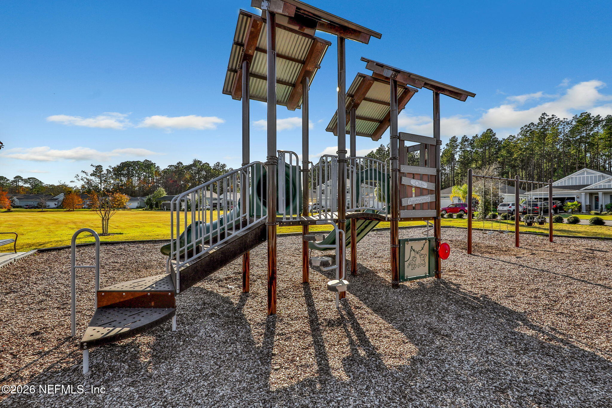 182 St Kitts Loop St. Augustine, FL 32092 - Photo 69 of 71 a view of swimming pool with sitting area and roof with stairs