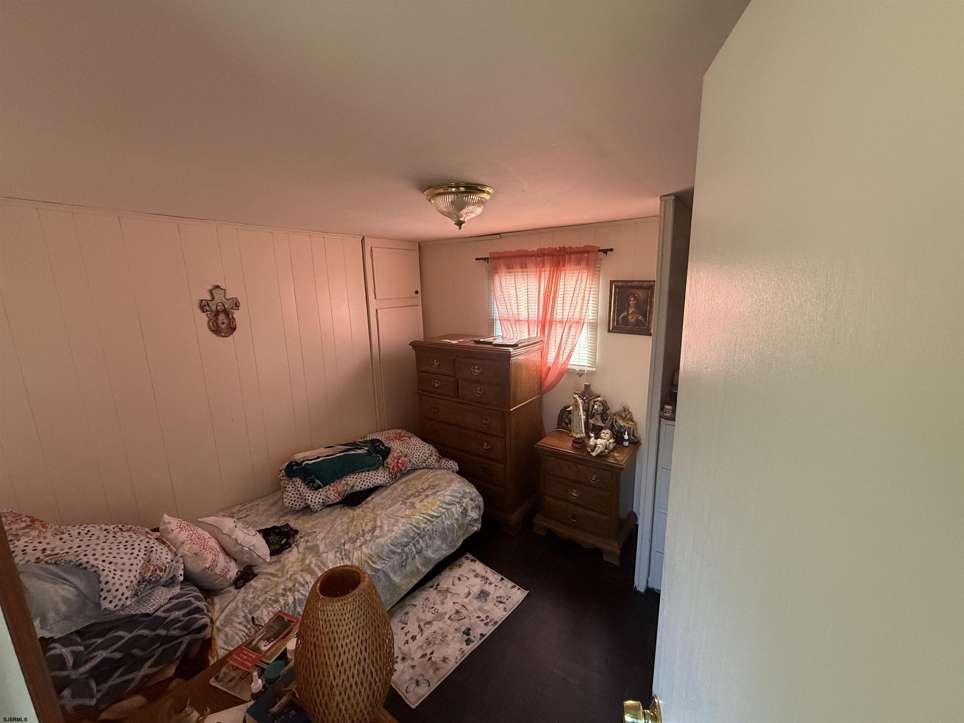 2501 Tilton Road Egg Harbor Township, NJ 08234 - Photo 13 of 20 a bedroom with a bed and a window