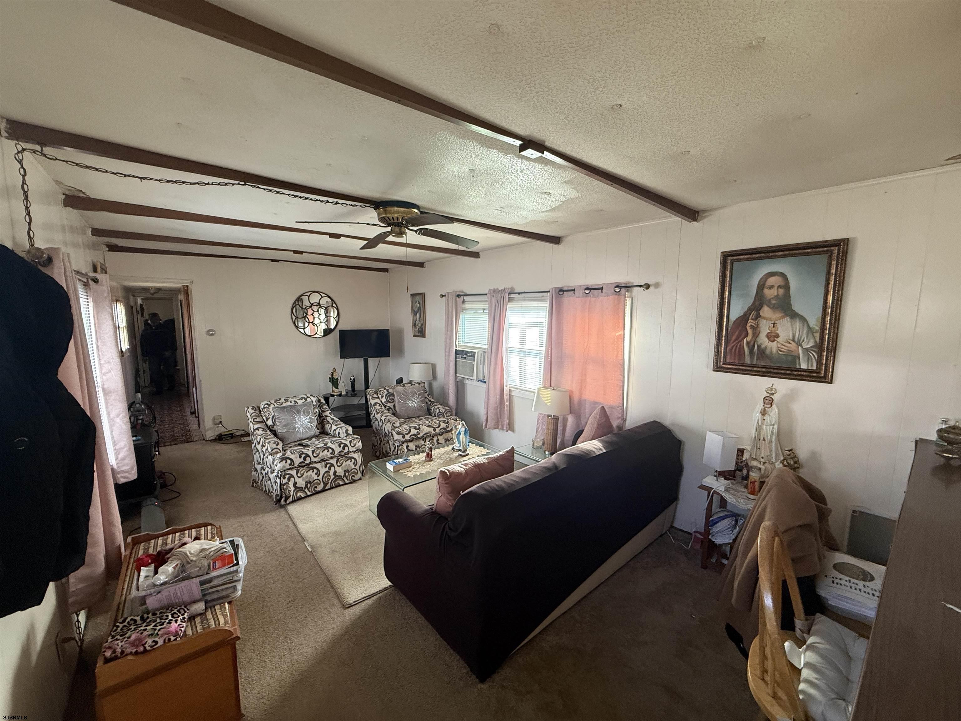 2501 Tilton Road Egg Harbor Township, NJ 08234 - Photo 14 of 20 a living room with furniture and a window