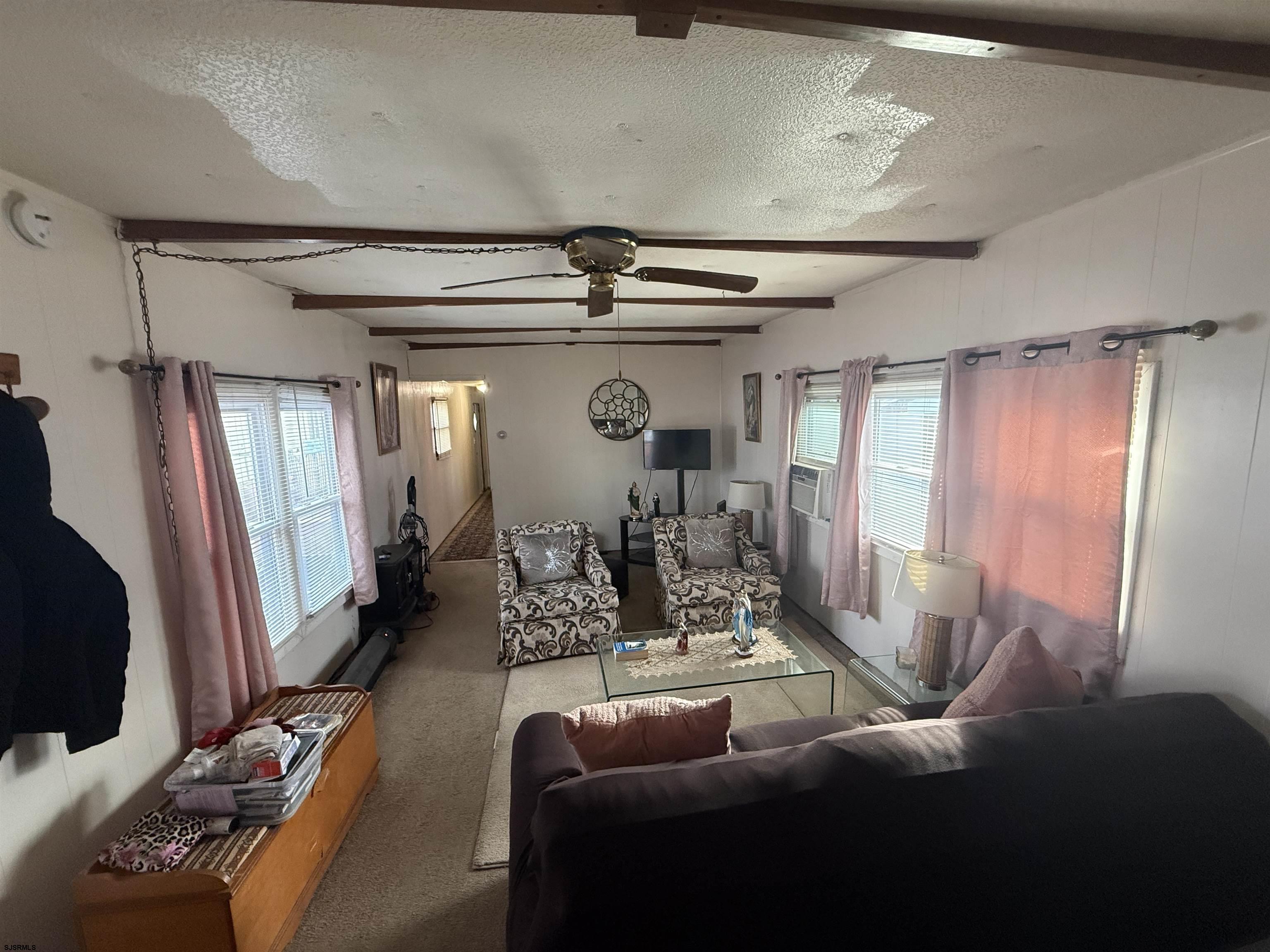 2501 Tilton Road Egg Harbor Township, NJ 08234 - Photo 5 of 20 a living room with furniture and a flat screen tv