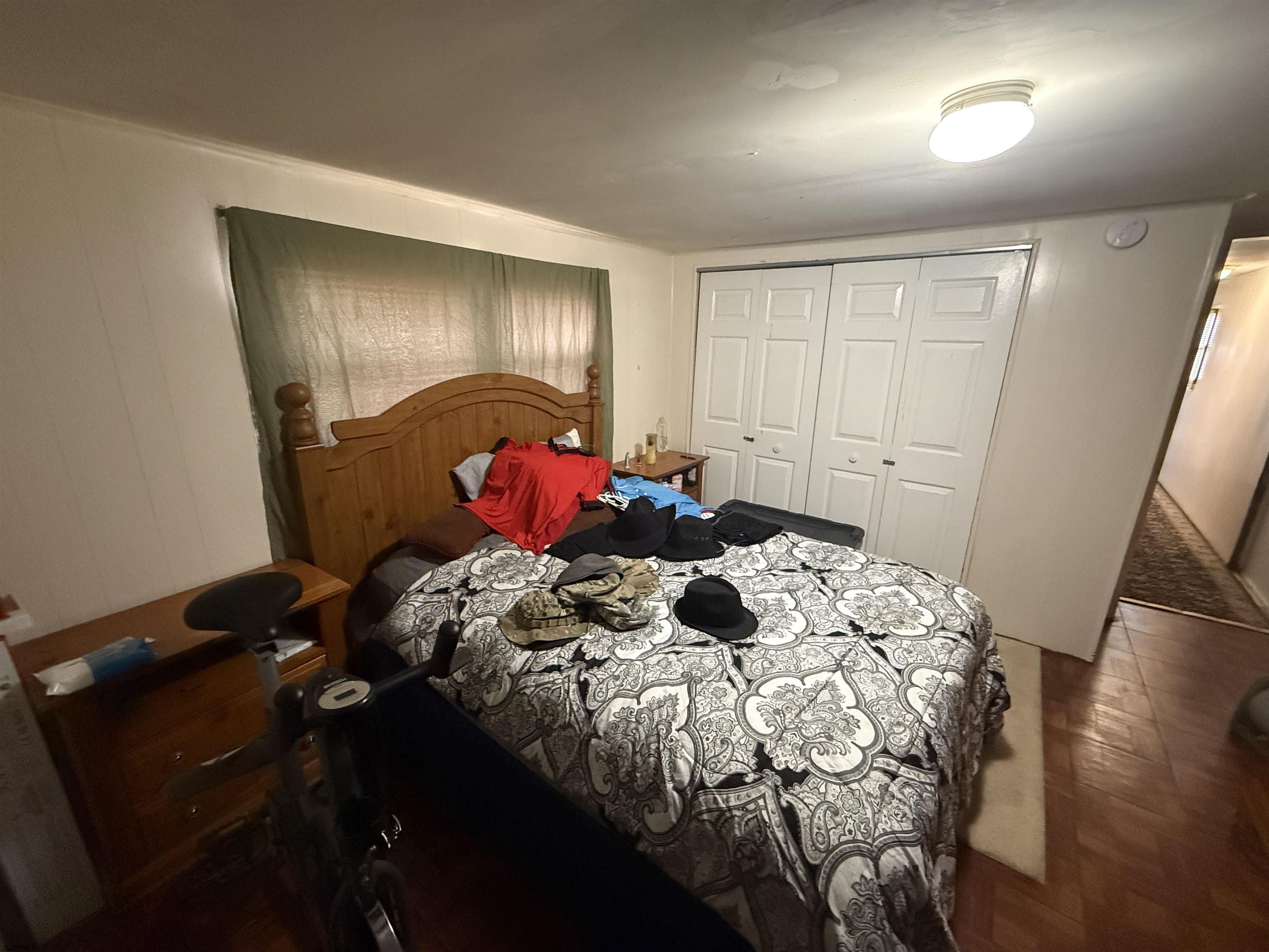 2501 Tilton Road Egg Harbor Township, NJ 08234 - Photo 7 of 20 a bed sitting in a bedroom next to a window