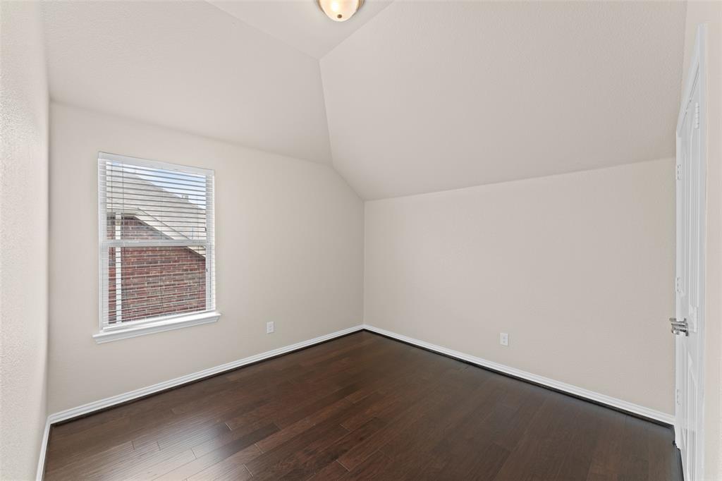 600 Fishback Circle Plano, TX 75074 - Photo 11 of 38 an empty room with wooden floor and windows
