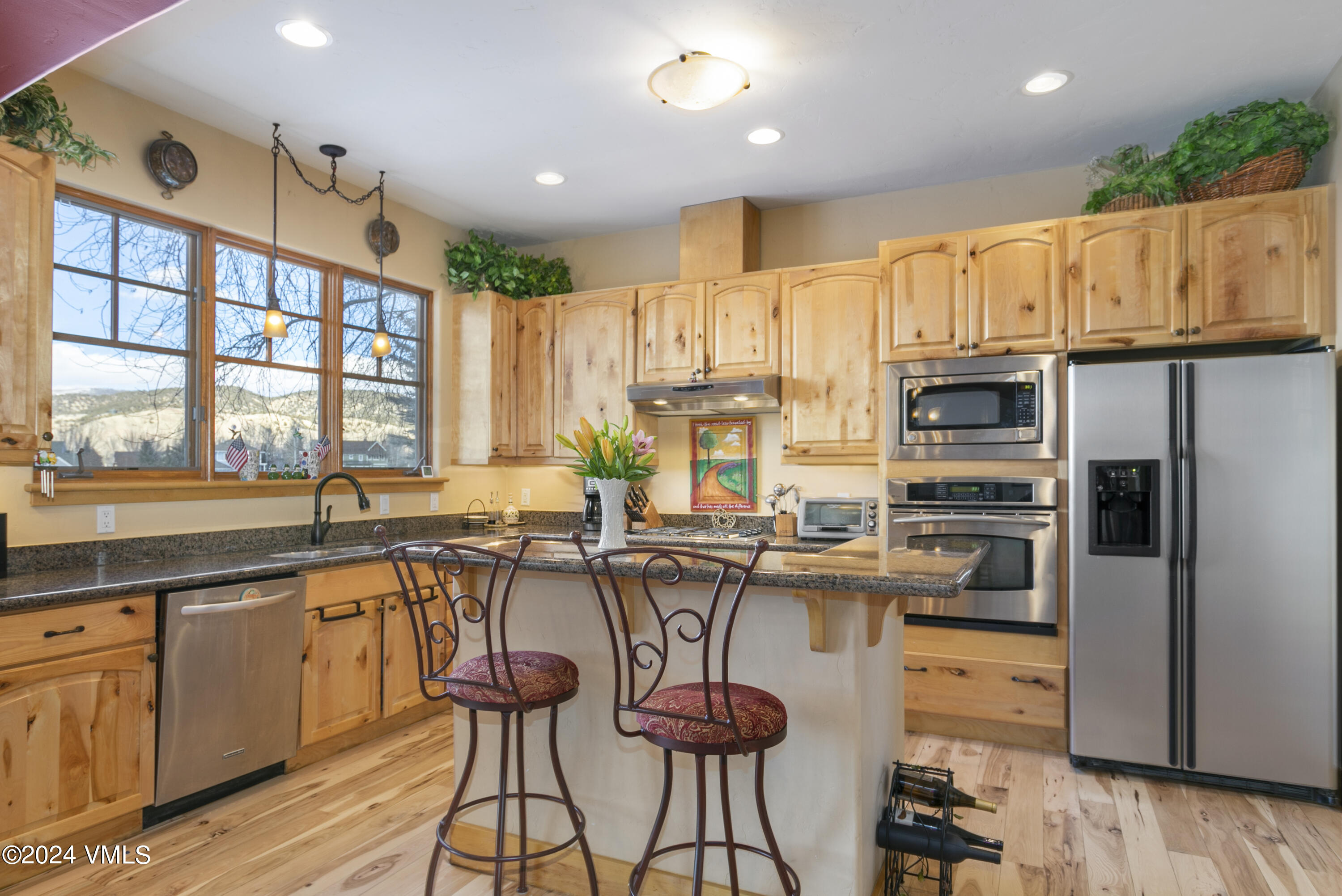 119 Sawmill Circle Eagle, CO 81631 - Photo 4 of 45 a kitchen with stainless steel appliances a stove a sink dishwasher and a refrigerator