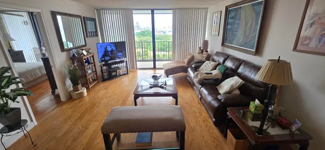 a living room with furniture and gym equipment