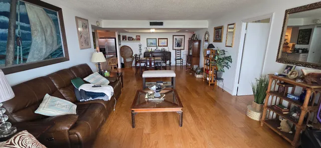 a bedroom with furniture and a flat screen tv