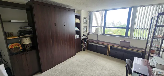 a view of a livingroom with furniture and windows