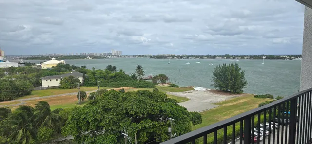 a view of a lake with houses in the back