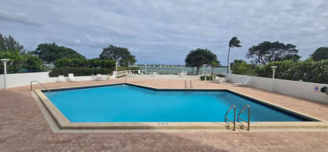 a view of swimming pool with outdoor seating