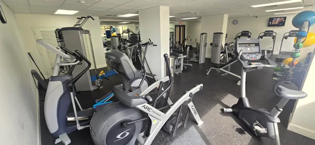 a room with pool table and windows