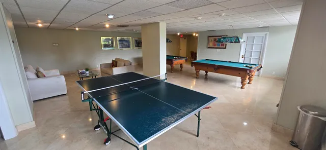 a view of a workspace with furniture