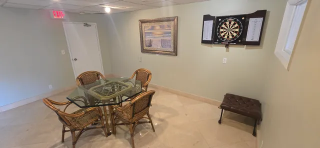 a livingroom with a bookshelf and a workspace