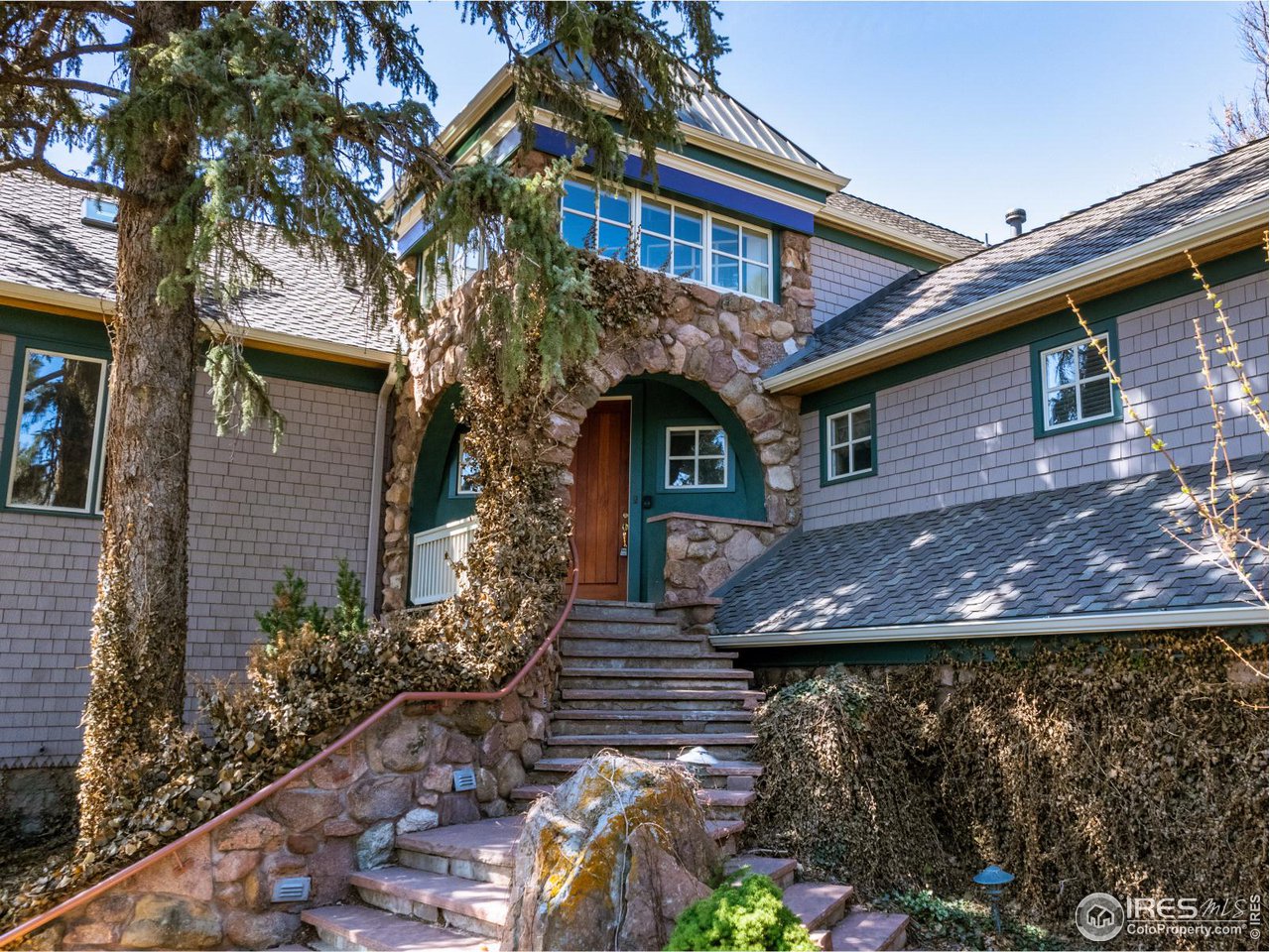 1033 5th Street Boulder, CO 80302 - Photo 2 of 14 a view of a house with brick walls and potted plants