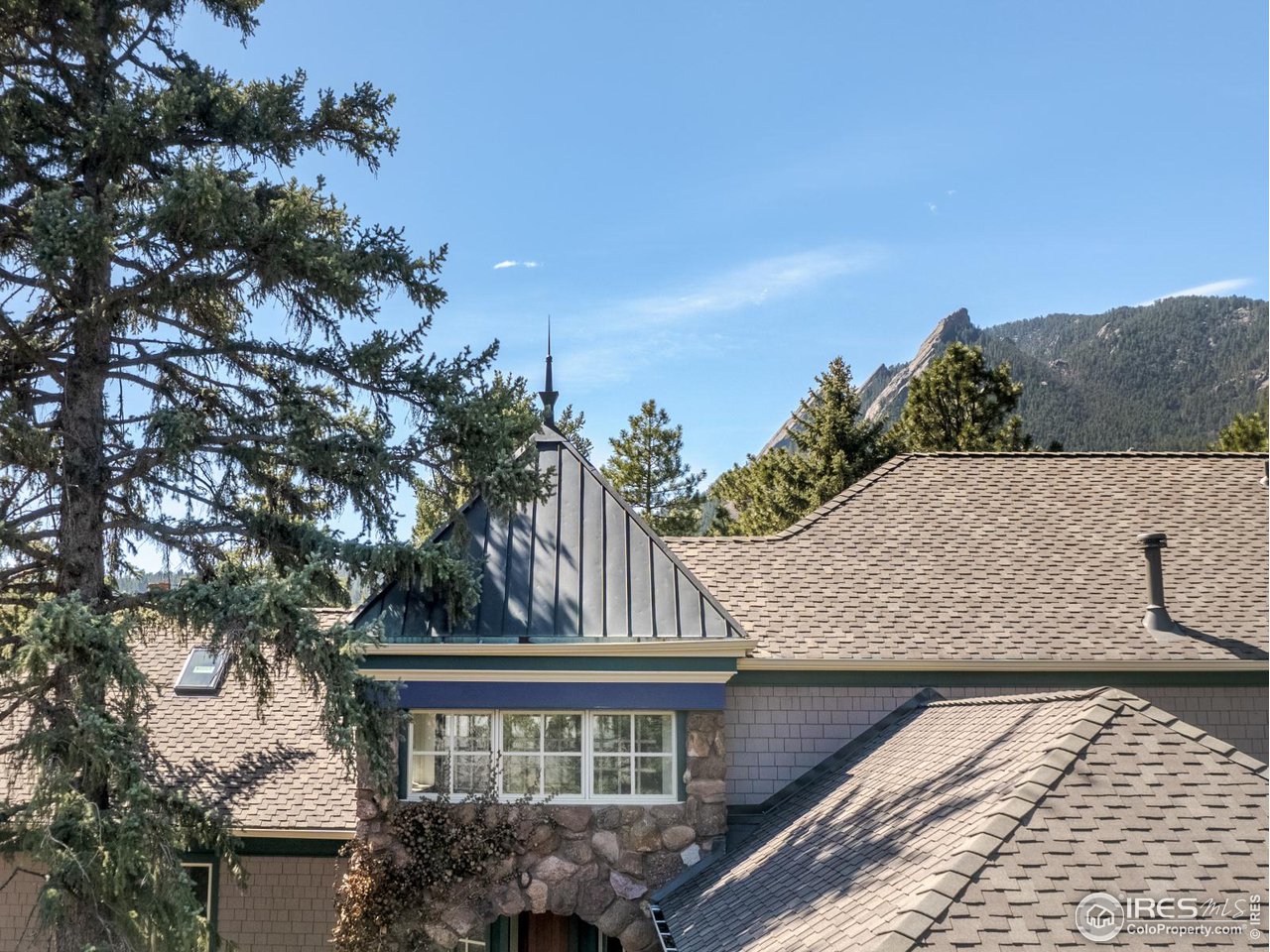 1033 5th Street Boulder, CO 80302 - Photo 5 of 14 a view of a house with a roof deck
