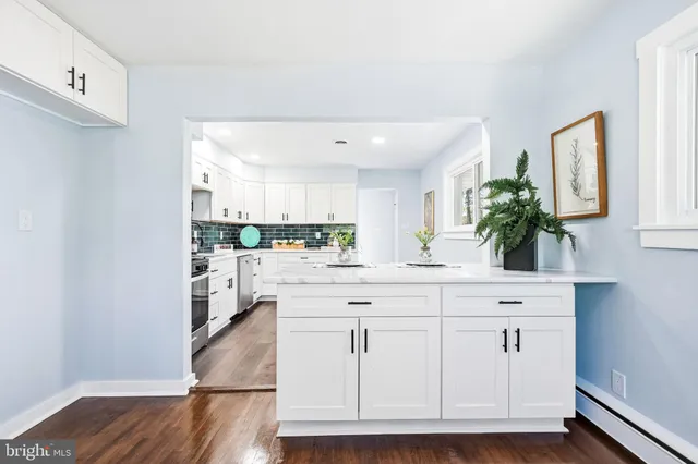 a spacious bathroom with a sink and a mirror