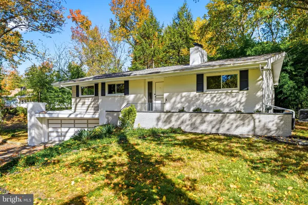 a view of a house with a chairs in patio