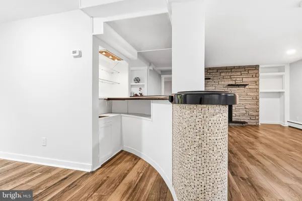 a view of kitchen with furniture and wooden floor