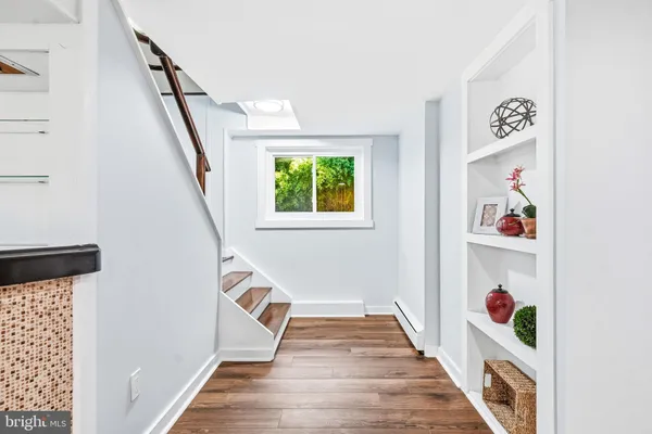a view of an entryway with wooden floor