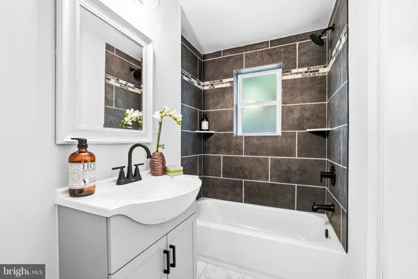 a bathroom with a sink and a bathtub